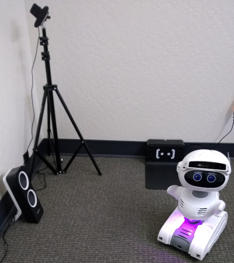 Misty II Field Trial robot located near its charging pad, and an offboard speaker and webcam